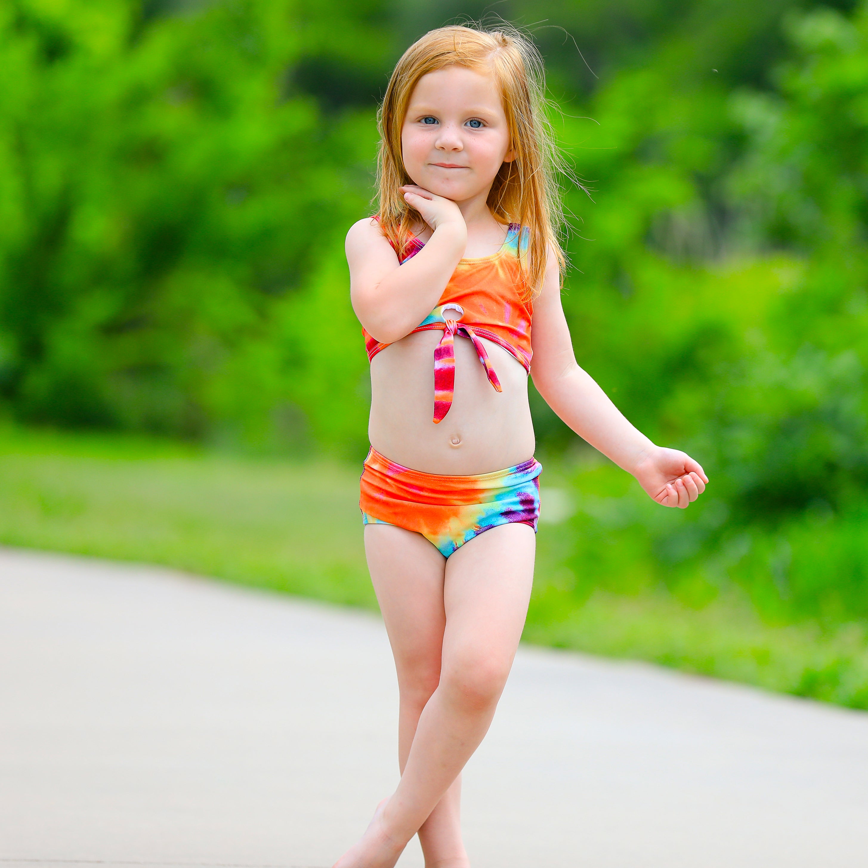 AL Limited Girls 2 piece Tie Dye Tankini Swimsuit featuring a rainbow swirl design with a tie knot tank top and high-waisted bottoms.